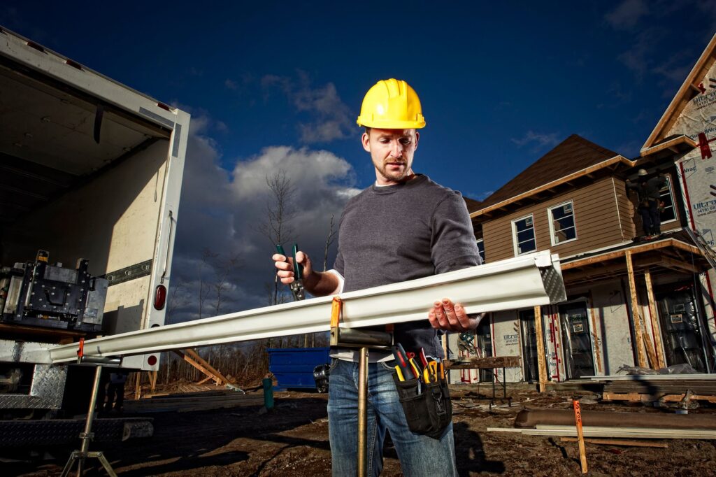 Photo of Crimping Gutter During Installation Process in Virginia Beach