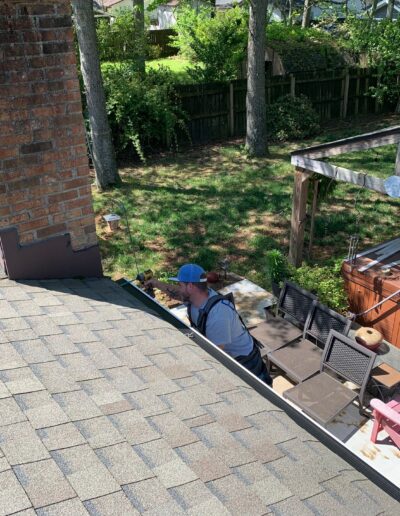 Virginia Beach Gutter Replacement In Process - Gutter Installation Expert Using Drill to Install Gutters Photo